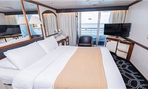 1734702206507balcony-deluxe-balcony-stateroom.jpg